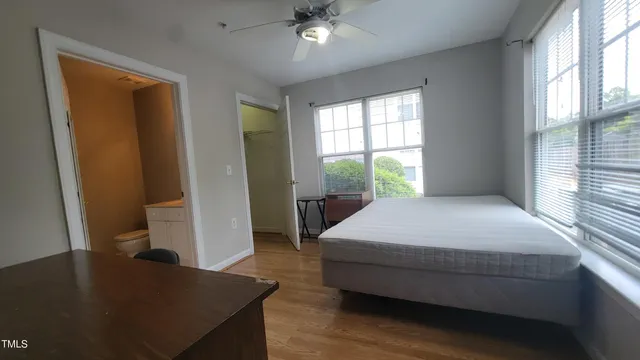 a bedroom with a bed and a table