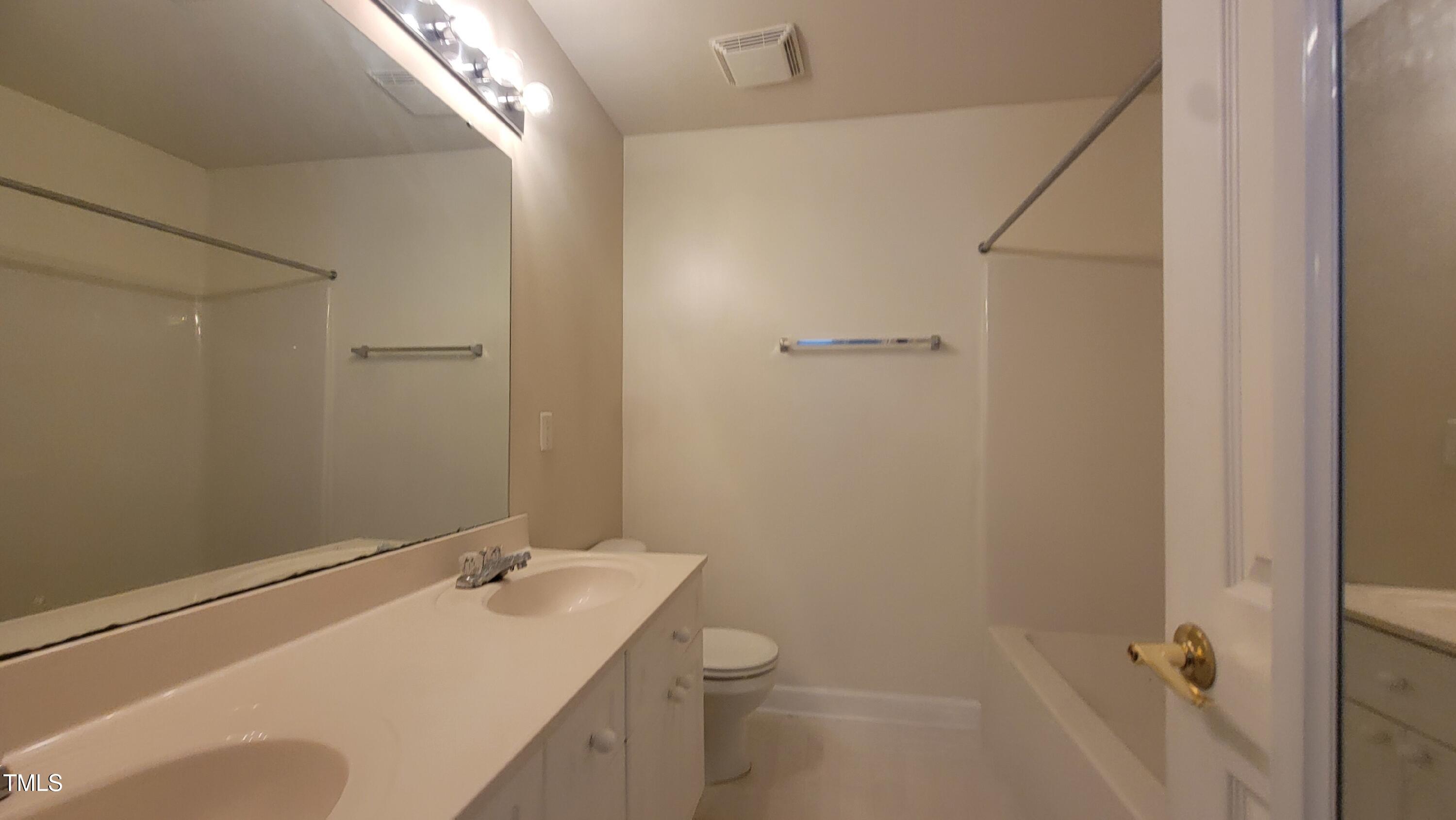 929 Morreene Road, Unit A13 Durham, NC 27705 - Photo 7 of 18 a bathroom with a sink toilet and shower