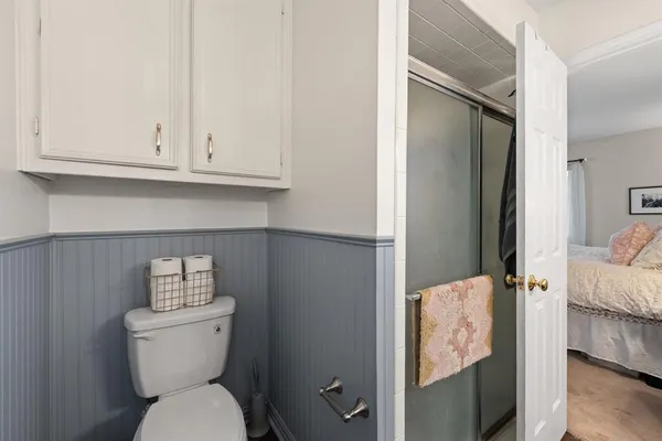 a bathroom with a toilet and a sink