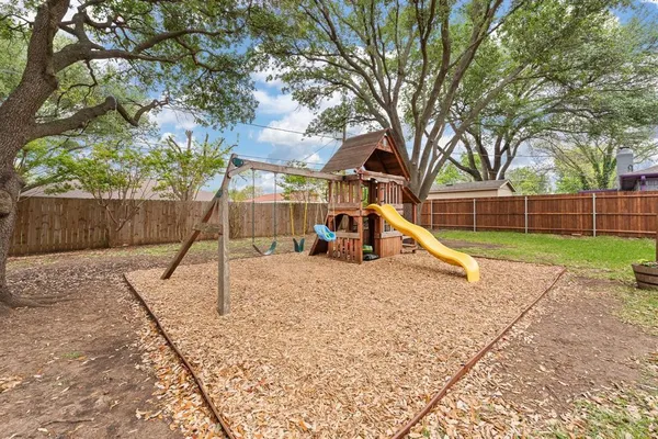 a view of a park with a slide