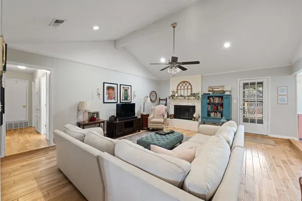 a living room with furniture and a fireplace