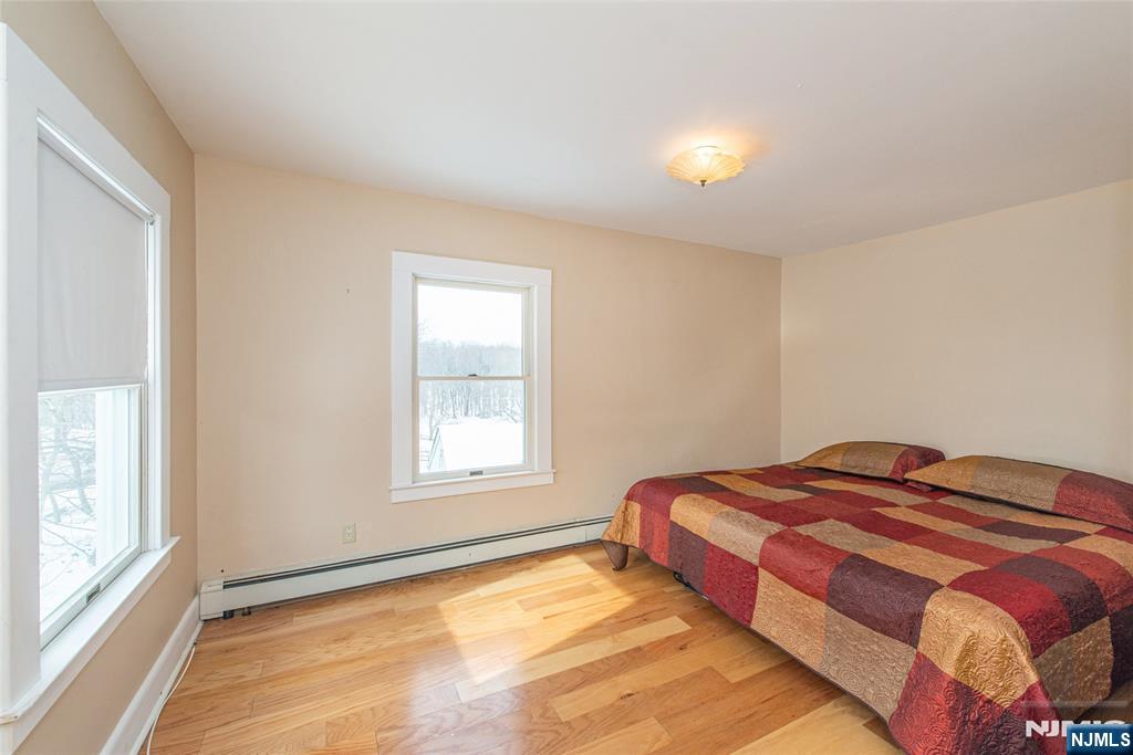 573 Wyckoff Avenue Mahwah, NJ 07430 - Photo 19 of 30 a bedroom with a bed and a window