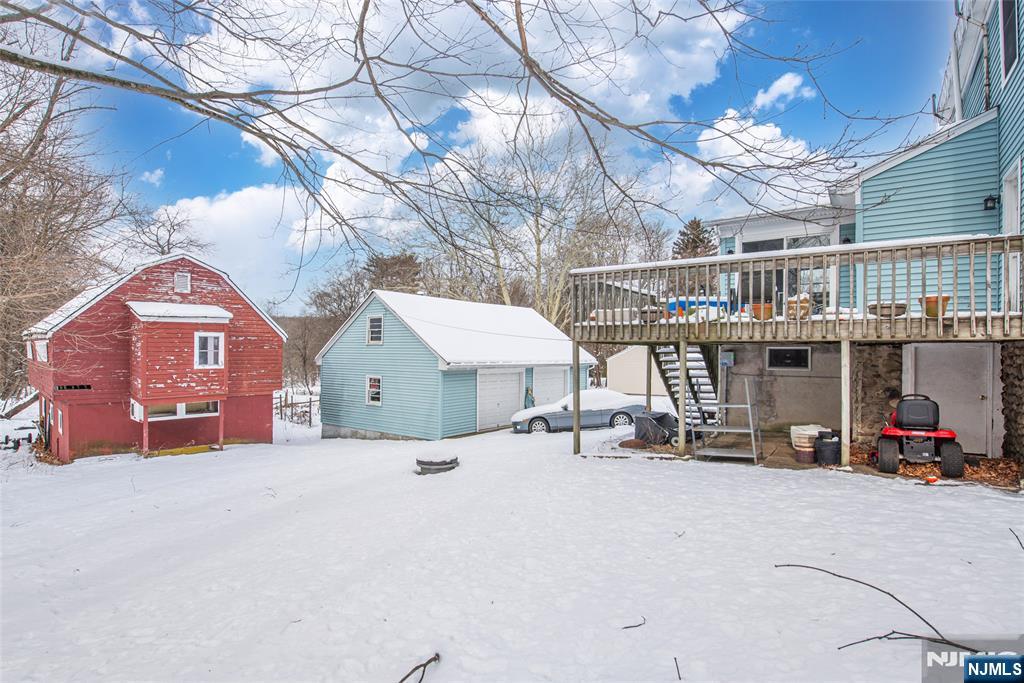 573 Wyckoff Avenue Mahwah, NJ 07430 - Photo 21 of 30 a view of a house with a patio and a yard