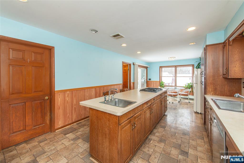 573 Wyckoff Avenue Mahwah, NJ 07430 - Photo 7 of 30 a spacious bathroom with a tub double vanity sink and mirror