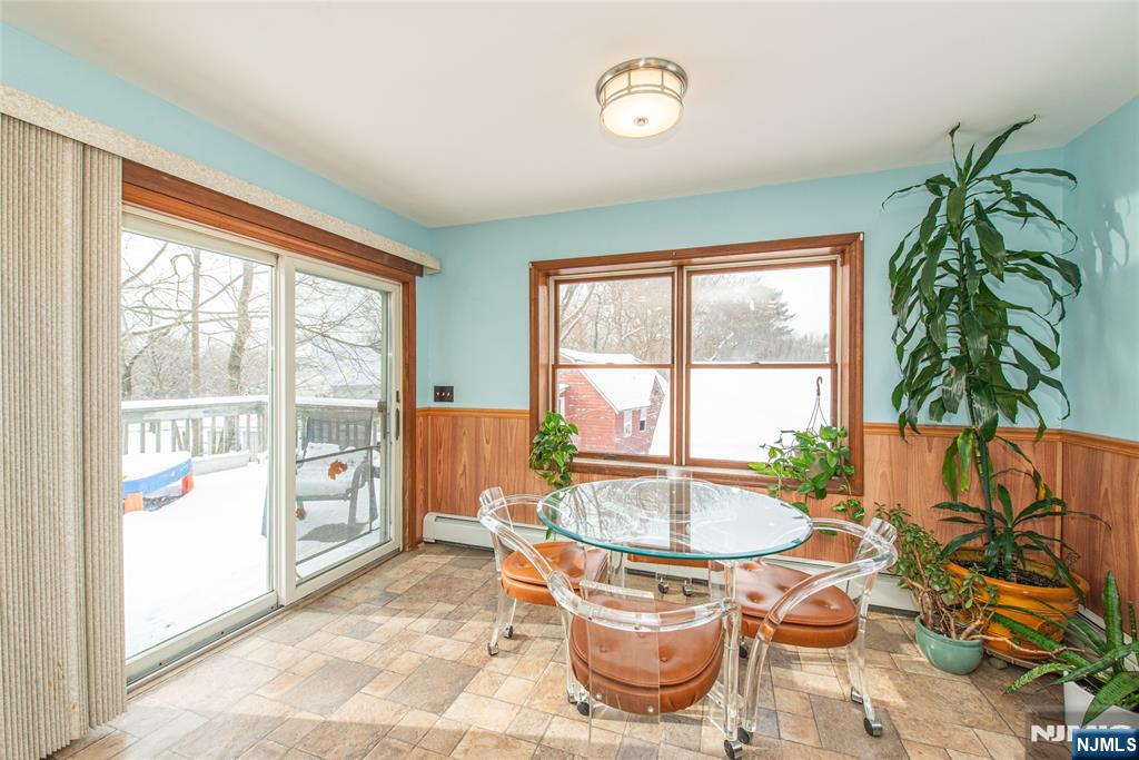 573 Wyckoff Avenue Mahwah, NJ 07430 - Photo 10 of 30 a dining room with furniture and a potted plant
