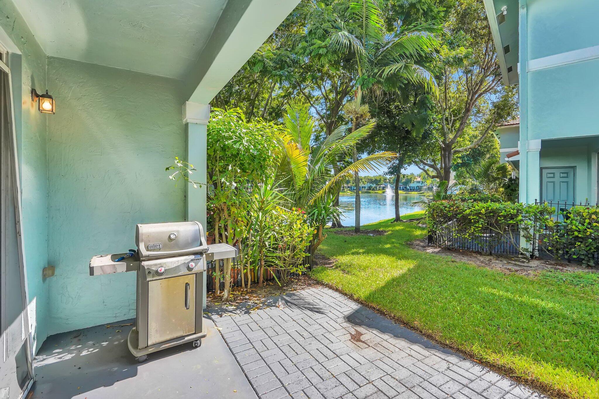 1969 Alamanda Way, Unit 1969 Riviera Beach, FL 33404 - Photo 14 of 26 a view of a backyard with a small yard