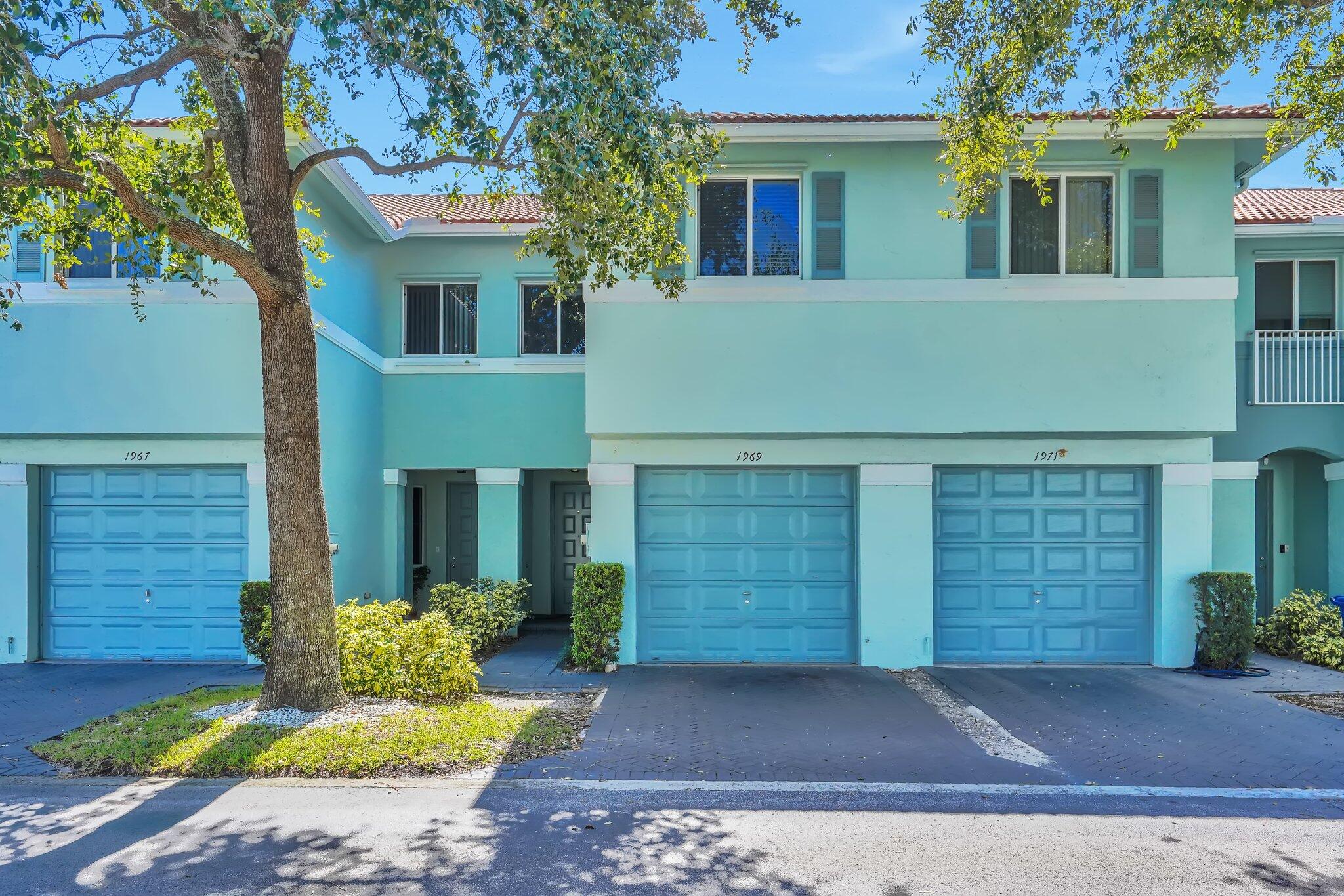 1969 Alamanda Way, Unit 1969 Riviera Beach, FL 33404 - Photo 16 of 26 a front view of a house with garden