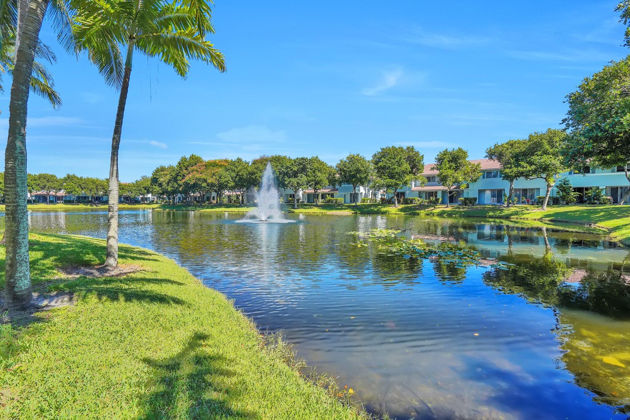 1969 Alamanda Way, Unit 1969 Riviera Beach, FL 33404 - Photo 18 of 26 a view of a lake with houses