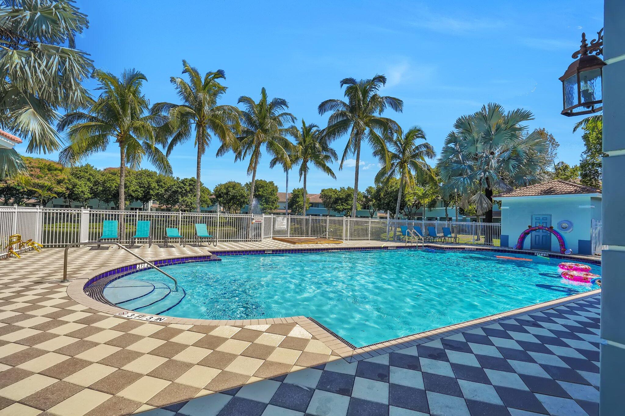 1969 Alamanda Way, Unit 1969 Riviera Beach, FL 33404 - Photo 20 of 26 a view of swimming pool with a garden