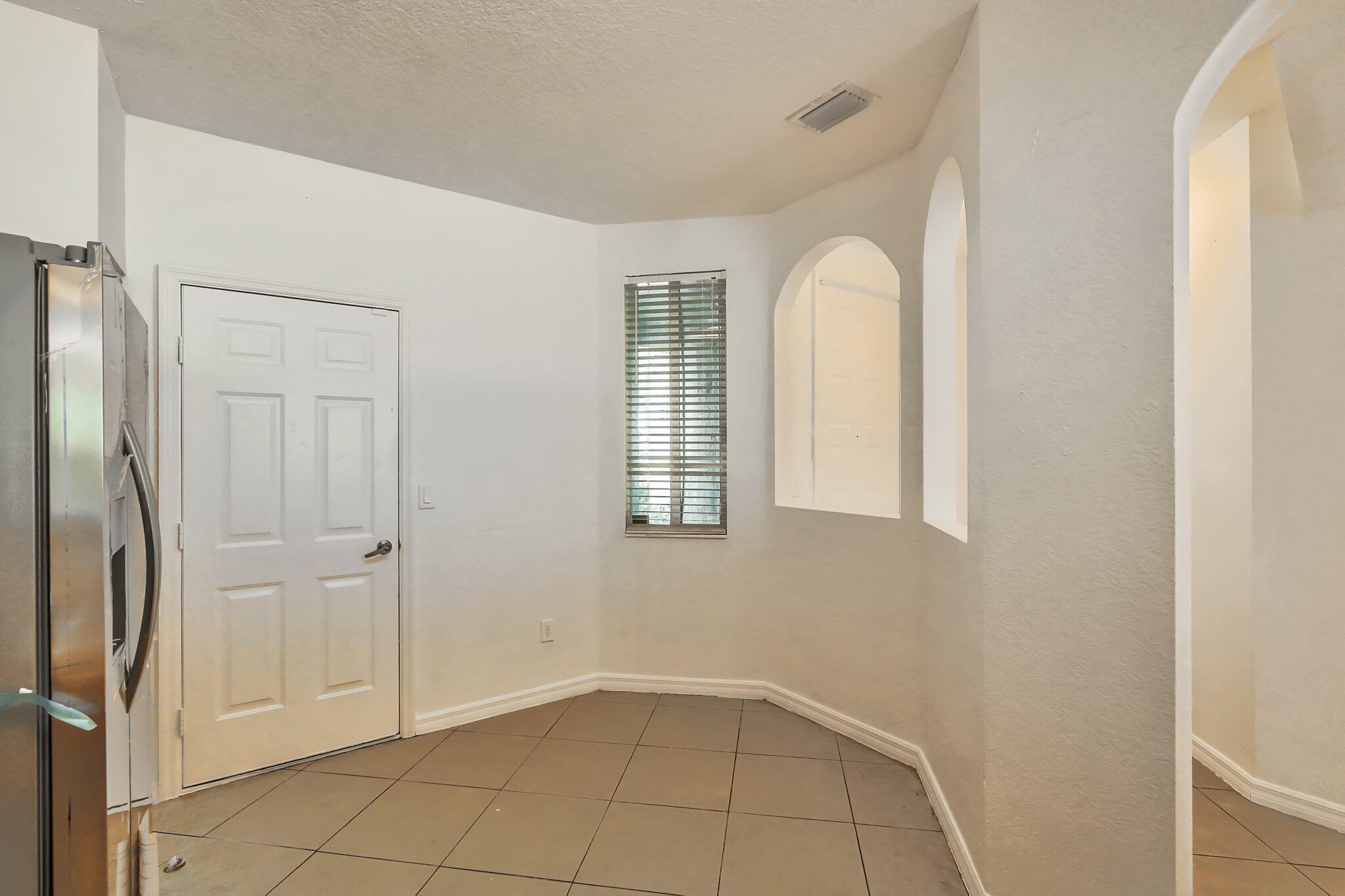 1969 Alamanda Way, Unit 1969 Riviera Beach, FL 33404 - Photo 5 of 26 a view of a livingroom with an entryway