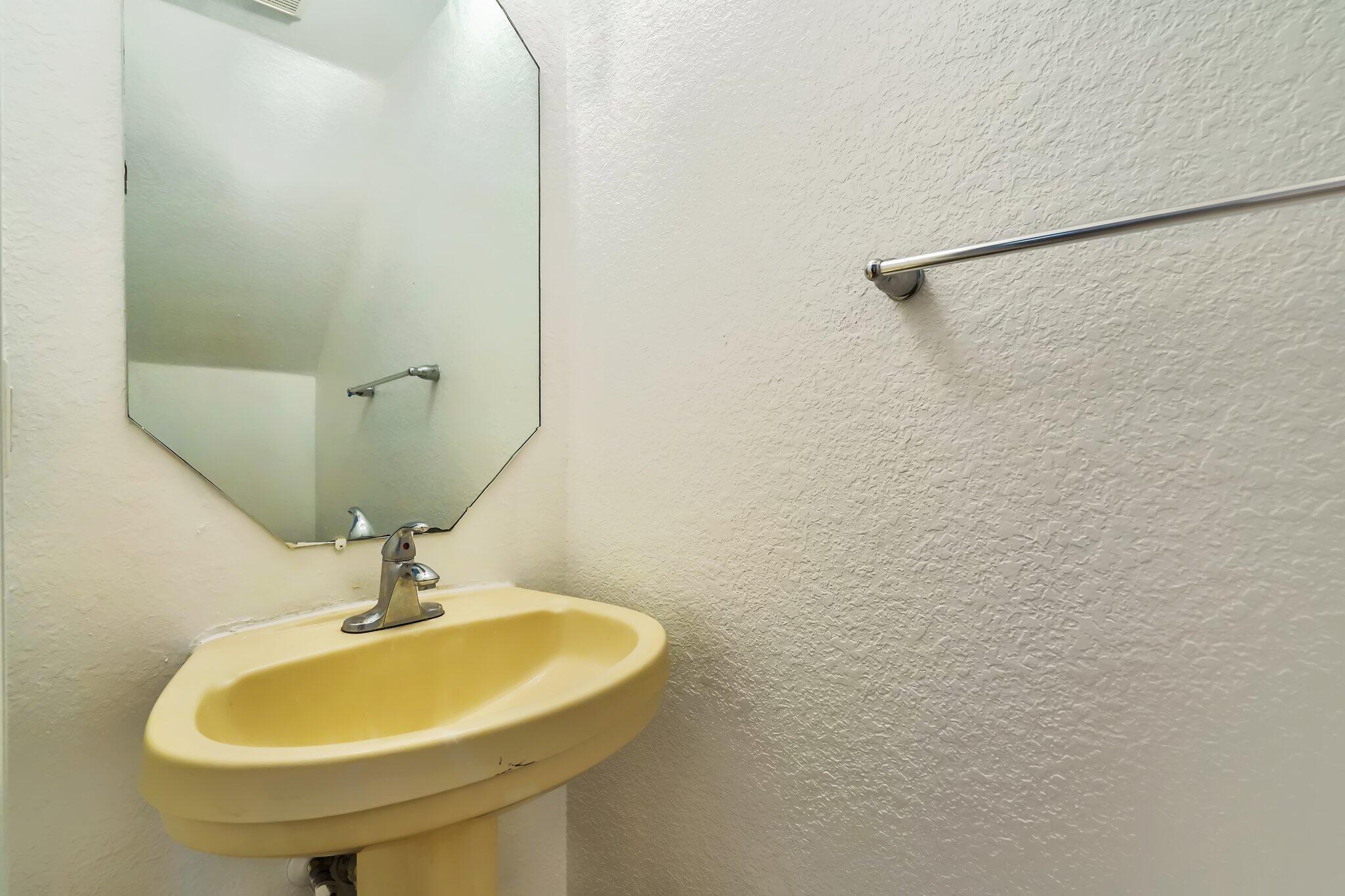 1969 Alamanda Way, Unit 1969 Riviera Beach, FL 33404 - Photo 6 of 26 a bathroom with a sink and a mirror