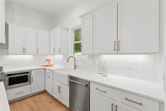 a spacious bedroom with a bed and a fireplace