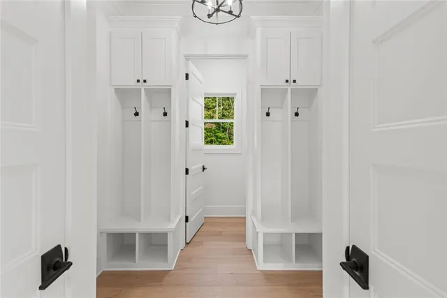 a white bath tub sitting next to a shower