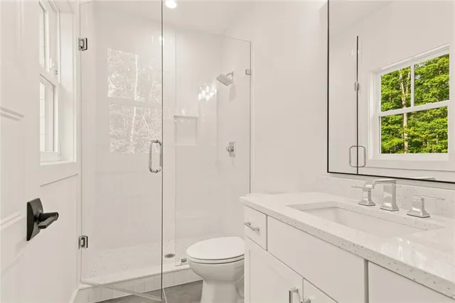 a backyard of a house with lots of green space and fountain