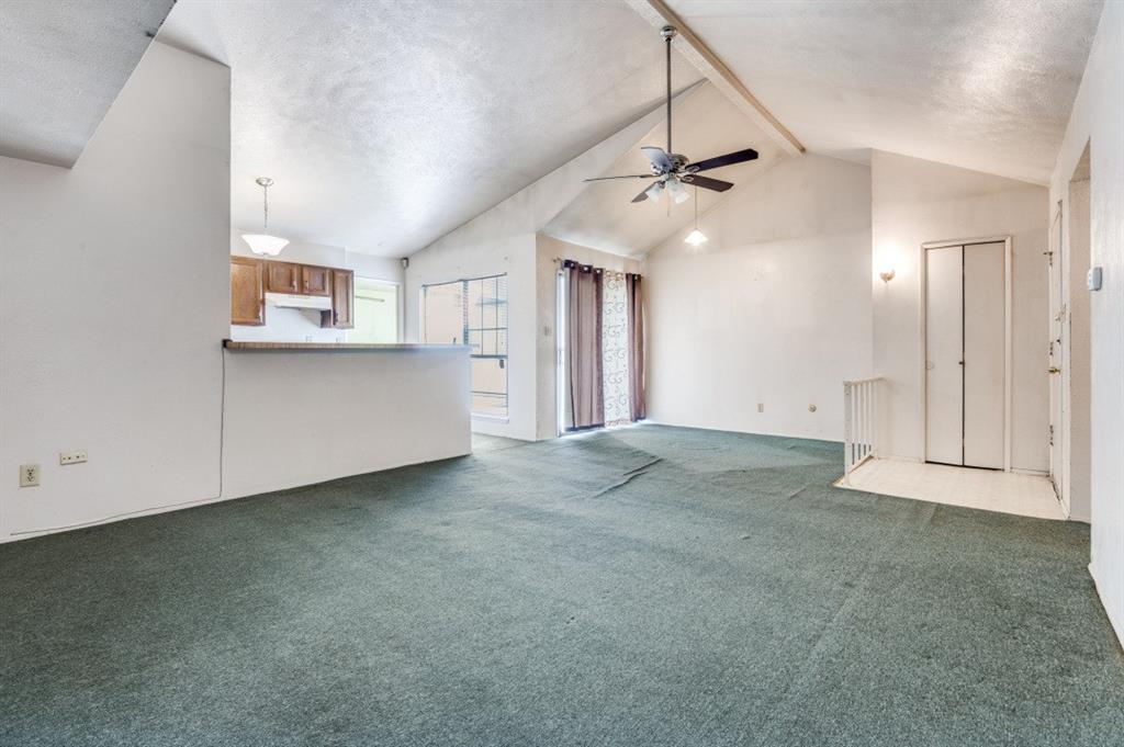 7049 Sorcey Road Dallas, TX 75249 - Photo 3 of 12 a view of an empty room with a ceiling fan