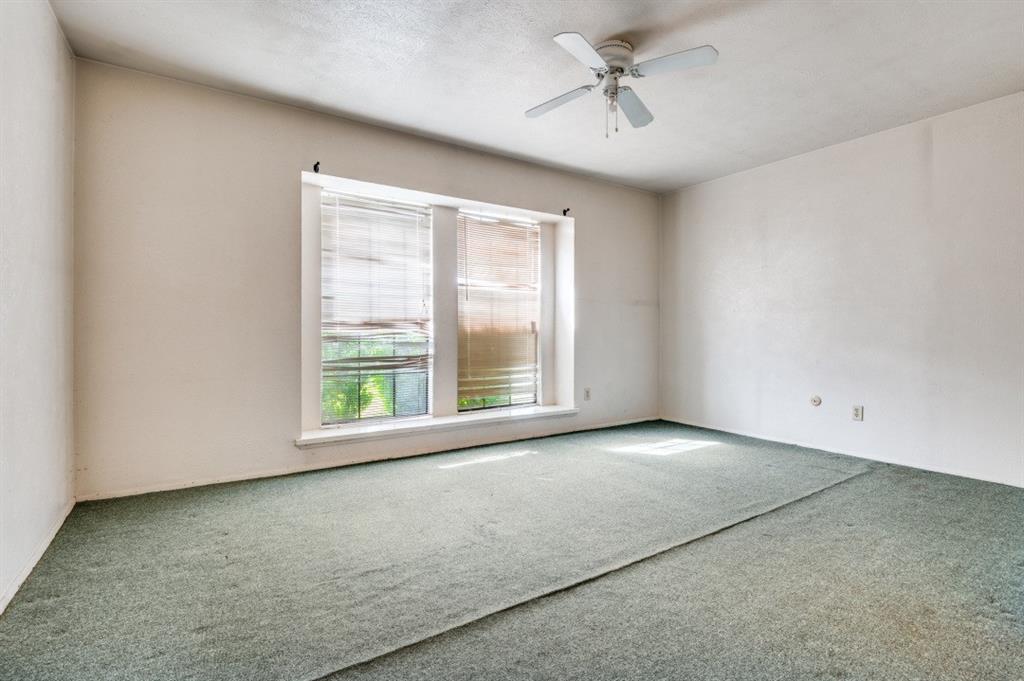 7049 Sorcey Road Dallas, TX 75249 - Photo 8 of 12 a view of an empty room with a window