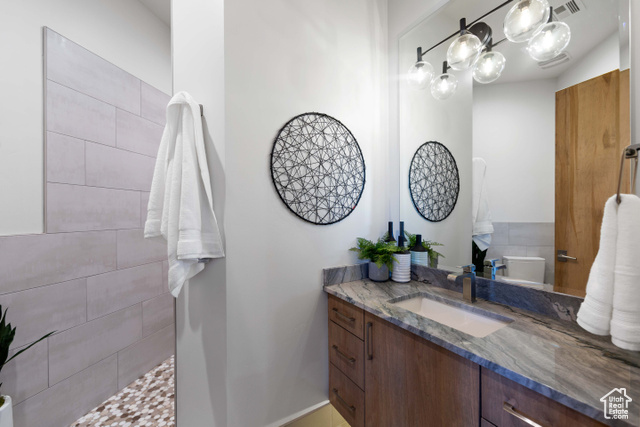 3558 South Cypress Road Hurricane, UT 84737 - Photo 33 of 57 Bathroom with vanity with extensive cabinet space and toilet