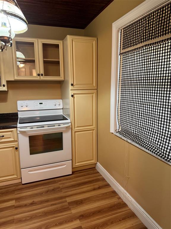 3774 Inverrary Boulevard, Unit 106P Lauderhill, FL 33319 - Photo 12 of 29 a kitchen with white cabinets and white appliances