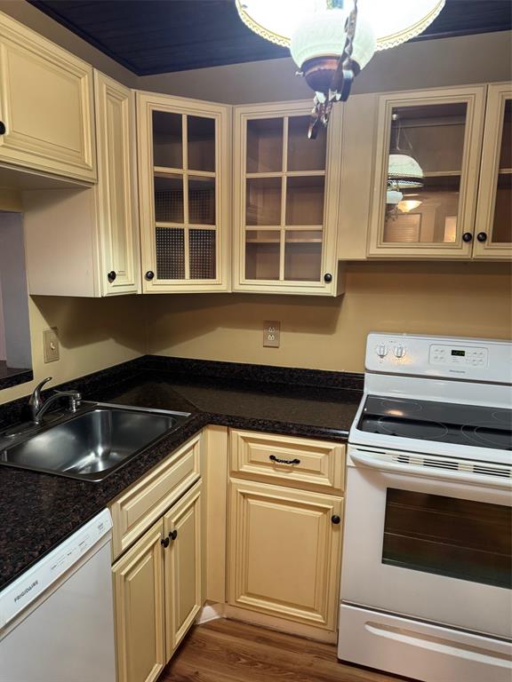 3774 Inverrary Boulevard, Unit 106P Lauderhill, FL 33319 - Photo 14 of 29 a kitchen with granite countertop a stove and white cabinets