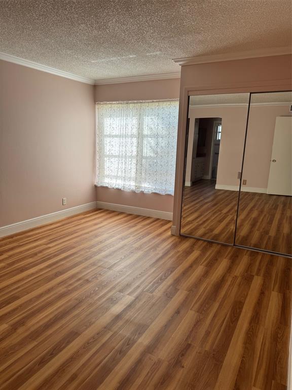 3774 Inverrary Boulevard, Unit 106P Lauderhill, FL 33319 - Photo 18 of 29 a view of empty room with wooden floor and fan