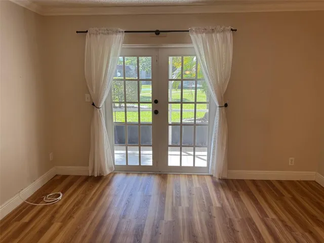 a view of entryway with wooden floor and door