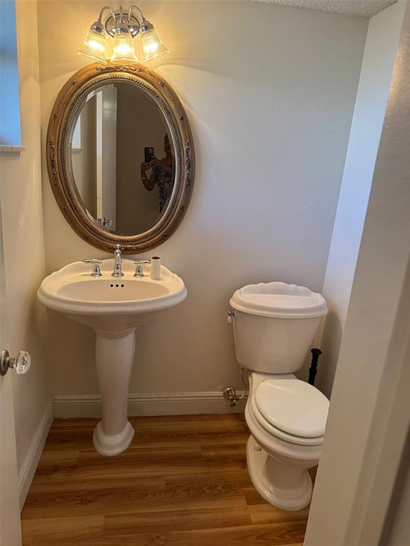 3774 Inverrary Boulevard, Unit 106P Lauderhill, FL 33319 - Photo 9 of 29 a bathroom with a toilet and a sink