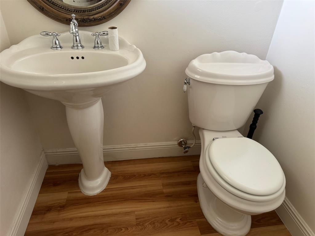 3774 Inverrary Boulevard, Unit 106P Lauderhill, FL 33319 - Photo 10 of 29 a bathroom with a sink and a toilet