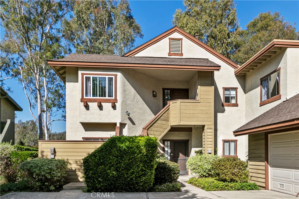 51 Rainbow Irvine, CA 92603 - Photo 1 of 25 a front view of a house with a yard