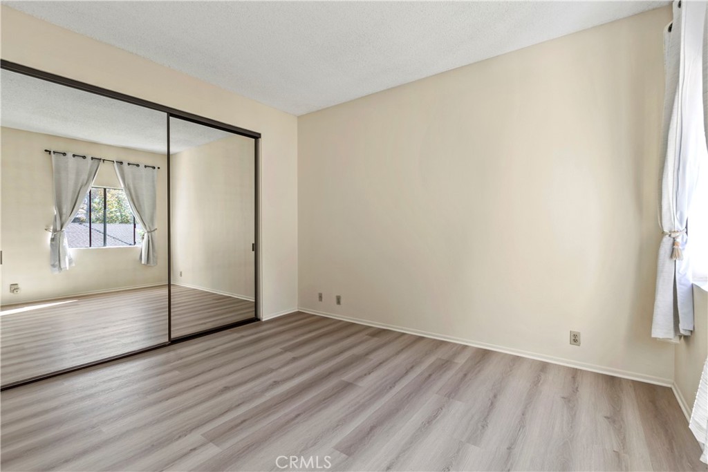 51 Rainbow Irvine, CA 92603 - Photo 13 of 25 an empty room with wooden floor and a window