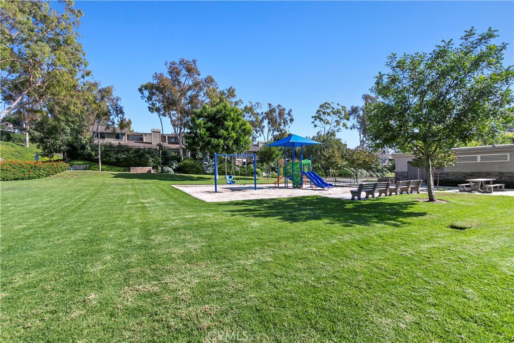 51 Rainbow Irvine, CA 92603 - Photo 22 of 25 a view of a park with swings and slides