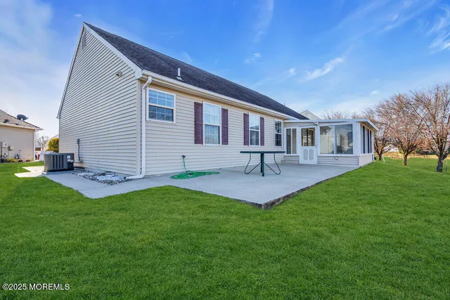 a front view of house with a garden