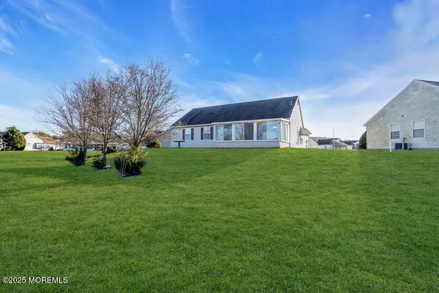 a view of a house with a big yard