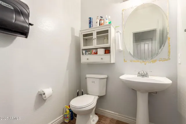 a view of an entryway with wooden floor