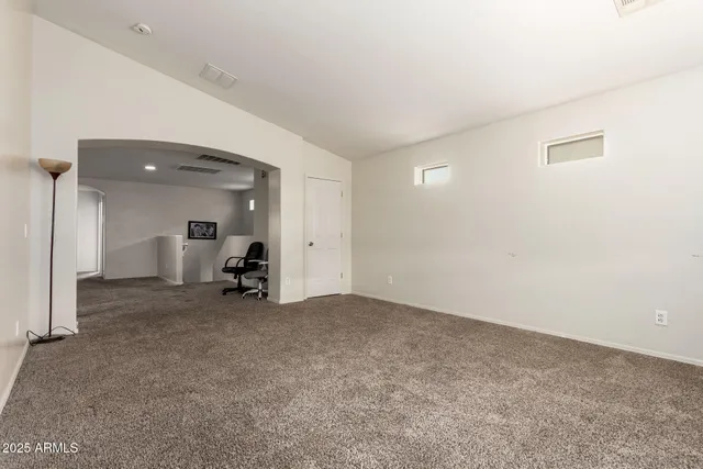 an empty room with a empty space and window