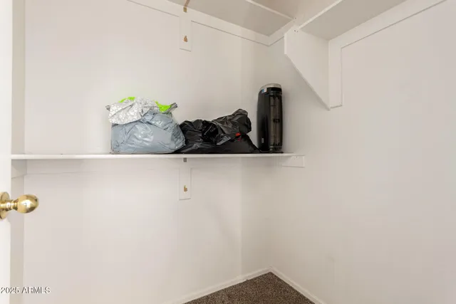 a room with furniture and a ceiling fan