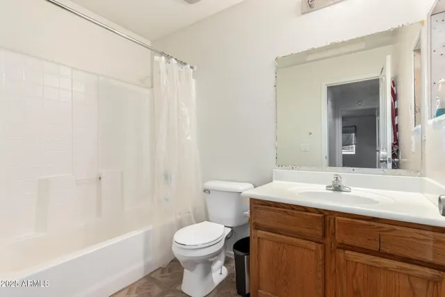 a kitchen with stainless steel appliances a refrigerator and a stove top oven