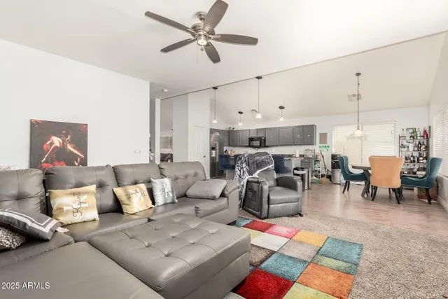 a living room with lots of furniture and a rug