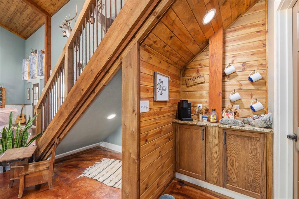 1601 County Road 156 Bangs, TX 76823 - Photo 11 of 40 a view of balcony with wooden floor and seating space
