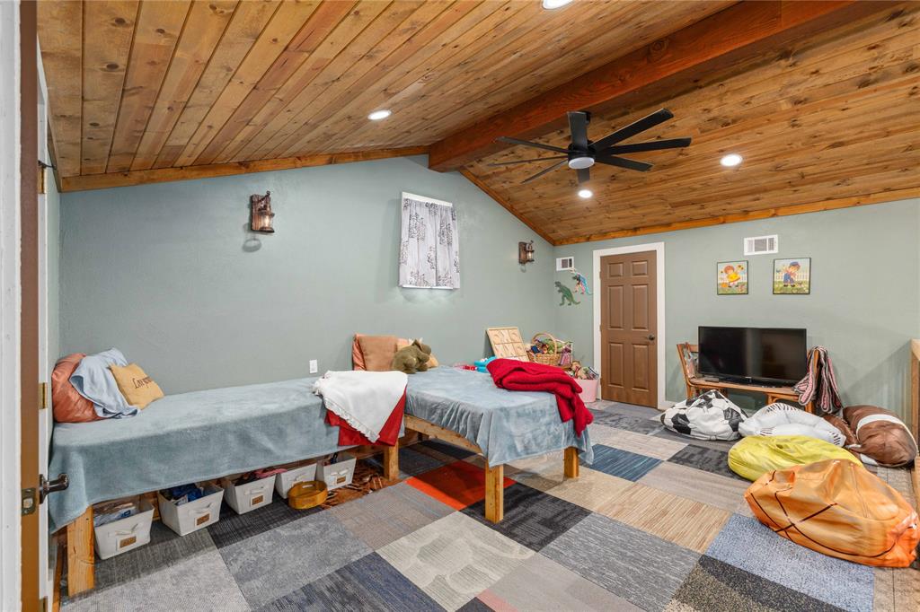 1601 County Road 156 Bangs, TX 76823 - Photo 20 of 40 a bedroom with furniture and a flat screen tv