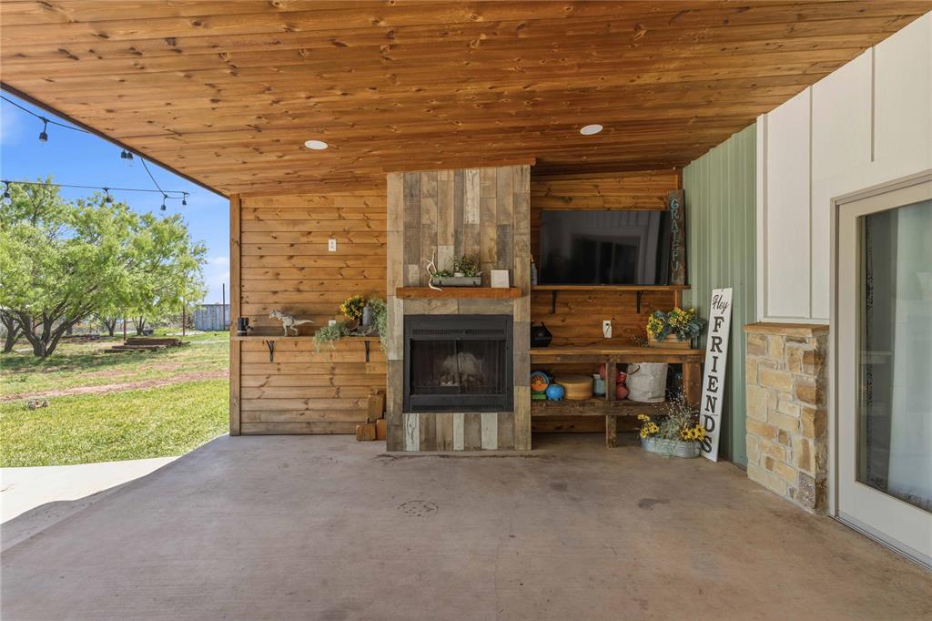 1601 County Road 156 Bangs, TX 76823 - Photo 29 of 40 a view of an empty room with a fireplace