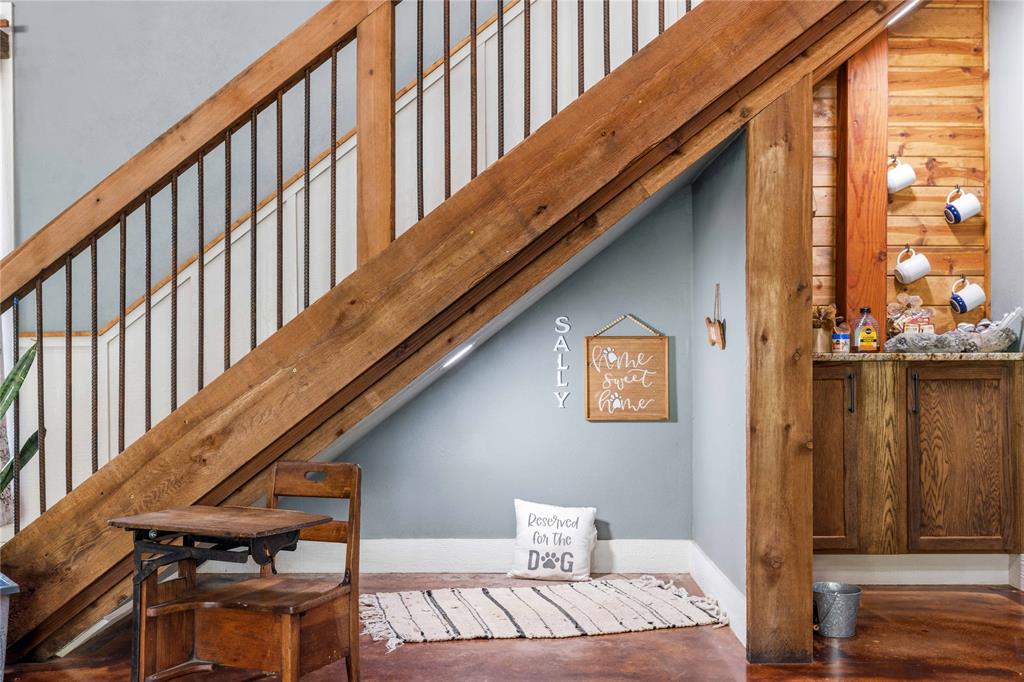 1601 County Road 156 Bangs, TX 76823 - Photo 6 of 40 a balcony with wooden floor stairs and furniture