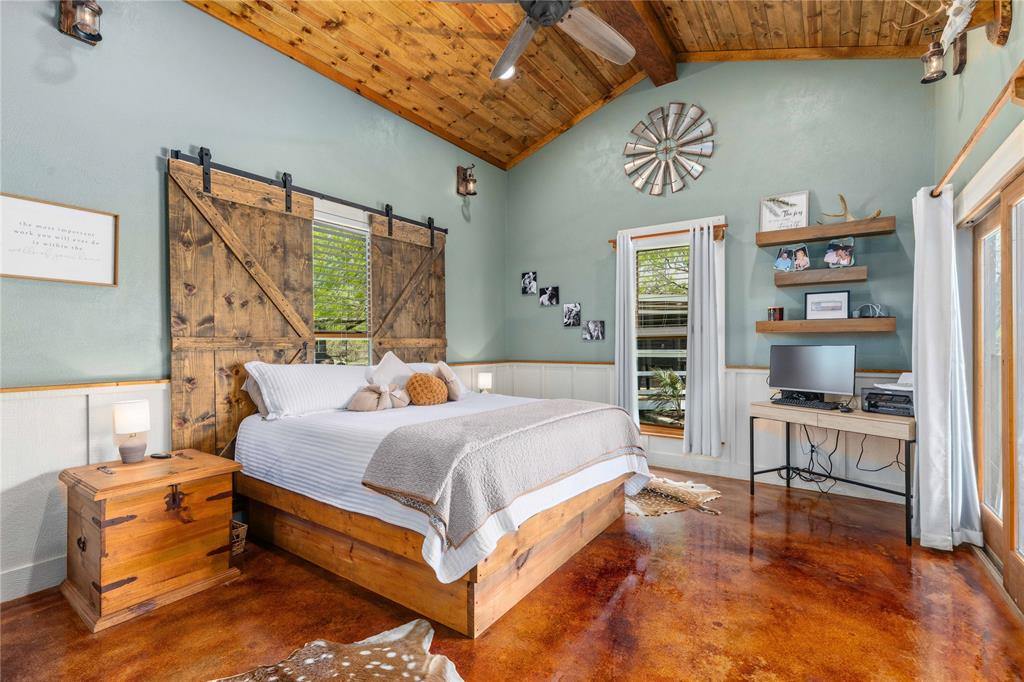 1601 County Road 156 Bangs, TX 76823 - Photo 8 of 40 a bed room with a bed and a chair