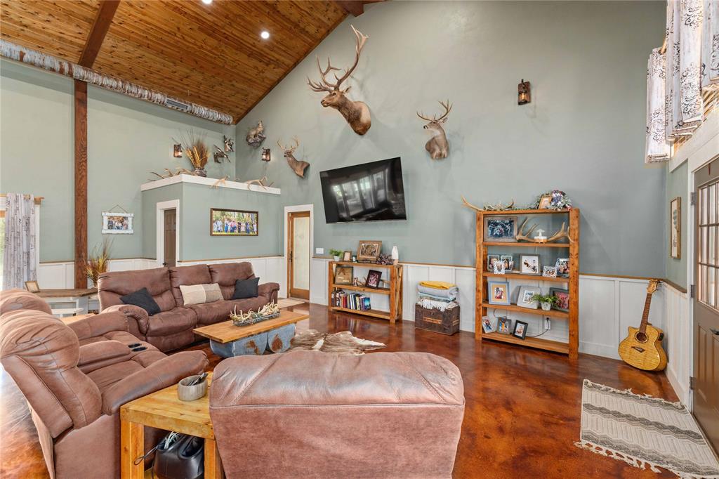 1601 County Road 156 Bangs, TX 76823 - Photo 9 of 40 a living room with furniture and a flat screen tv