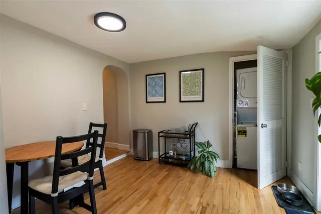 a view of a livingroom with furniture and hardwood floor