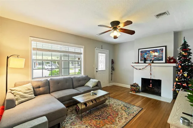 a living room with furniture and a fireplace