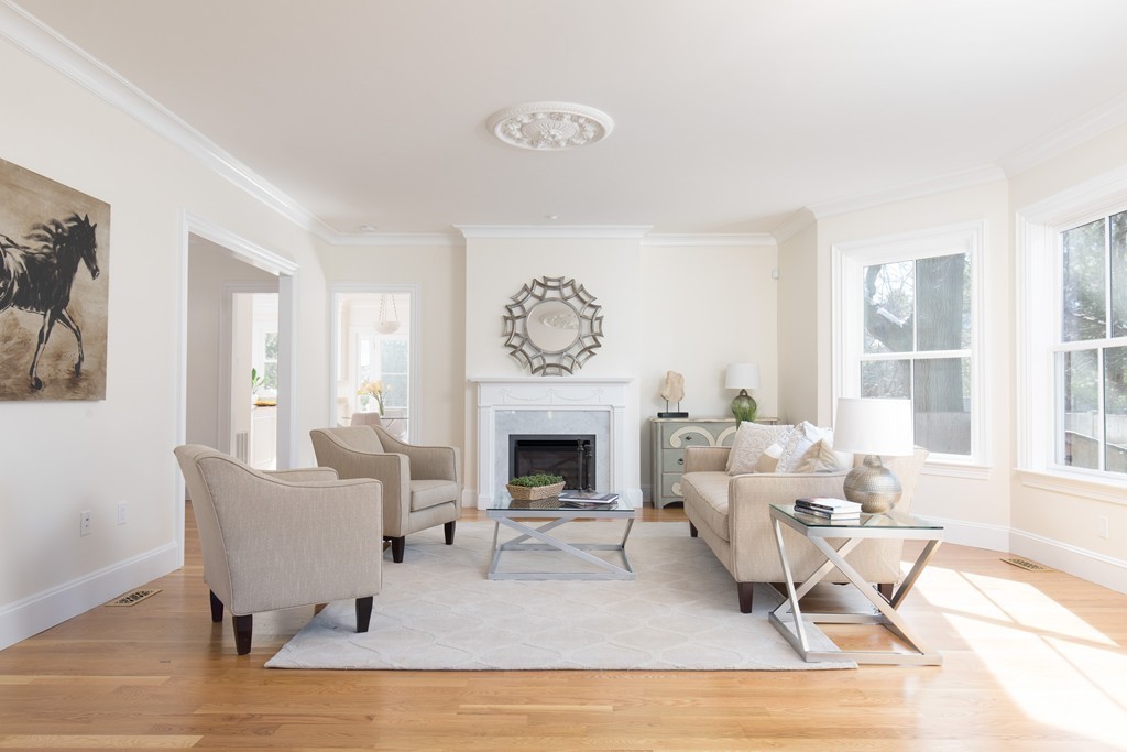 26 Parker Street Cambridge, MA 02138 - Photo 11 of 29 a living room with furniture and a fireplace