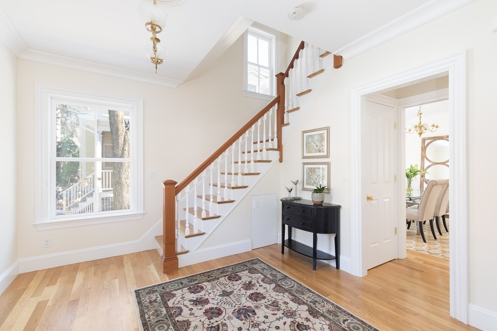 26 Parker Street Cambridge, MA 02138 - Photo 15 of 29 a view of entryway with wooden floor and stairs