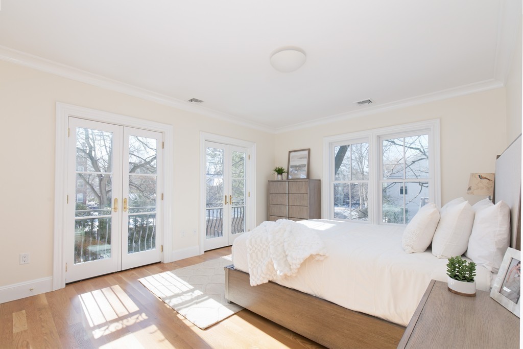 26 Parker Street Cambridge, MA 02138 - Photo 17 of 29 a bedroom with a large bed and a large window