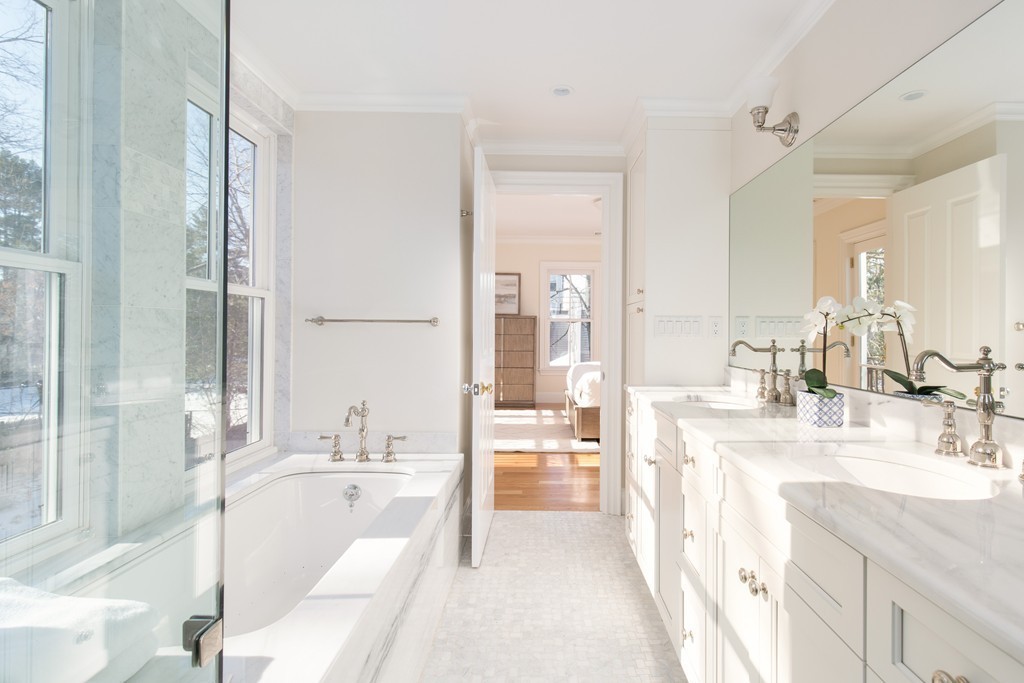 26 Parker Street Cambridge, MA 02138 - Photo 18 of 29 a spacious bathroom with a bathtub sink and mirror