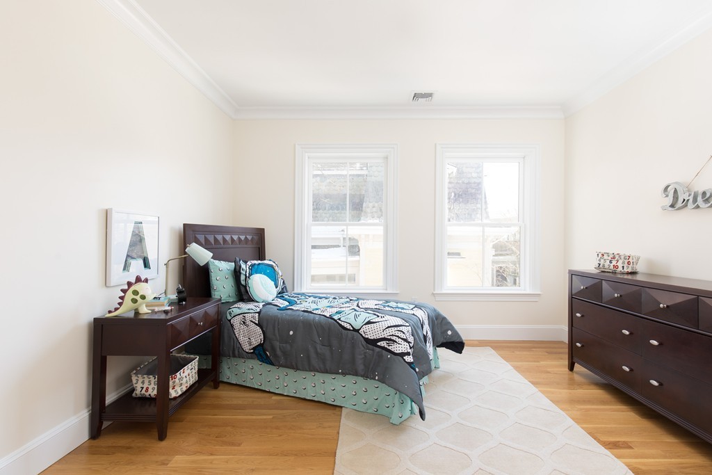 26 Parker Street Cambridge, MA 02138 - Photo 21 of 29 a bedroom with a bed and window
